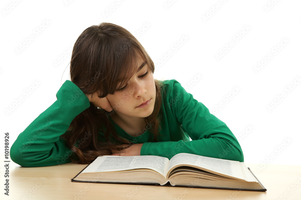Young girl reading book isolated on white Young girl reading book isolated on white