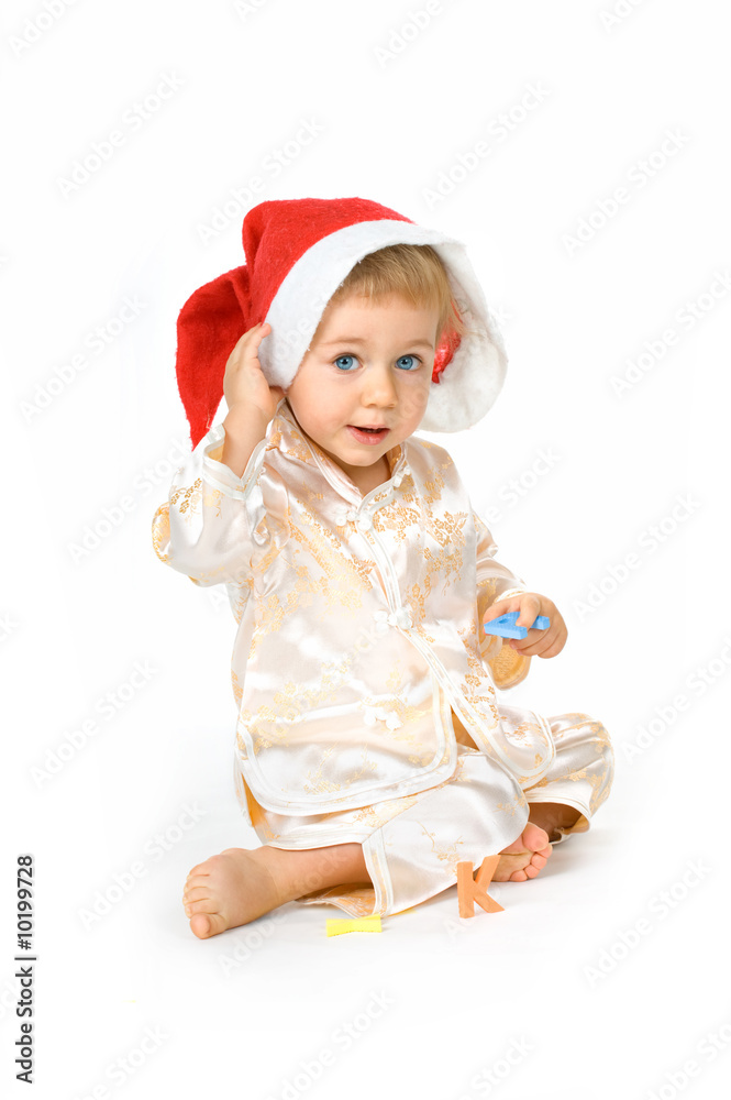 Cheerful baby girl wearing Santa Claus hat Cheerful baby girl wearing Santa Claus hat
