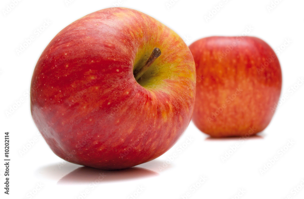 The red apples on white. Isolation, shallow DOF. The red apples on white. Isolation, shallow DOF.