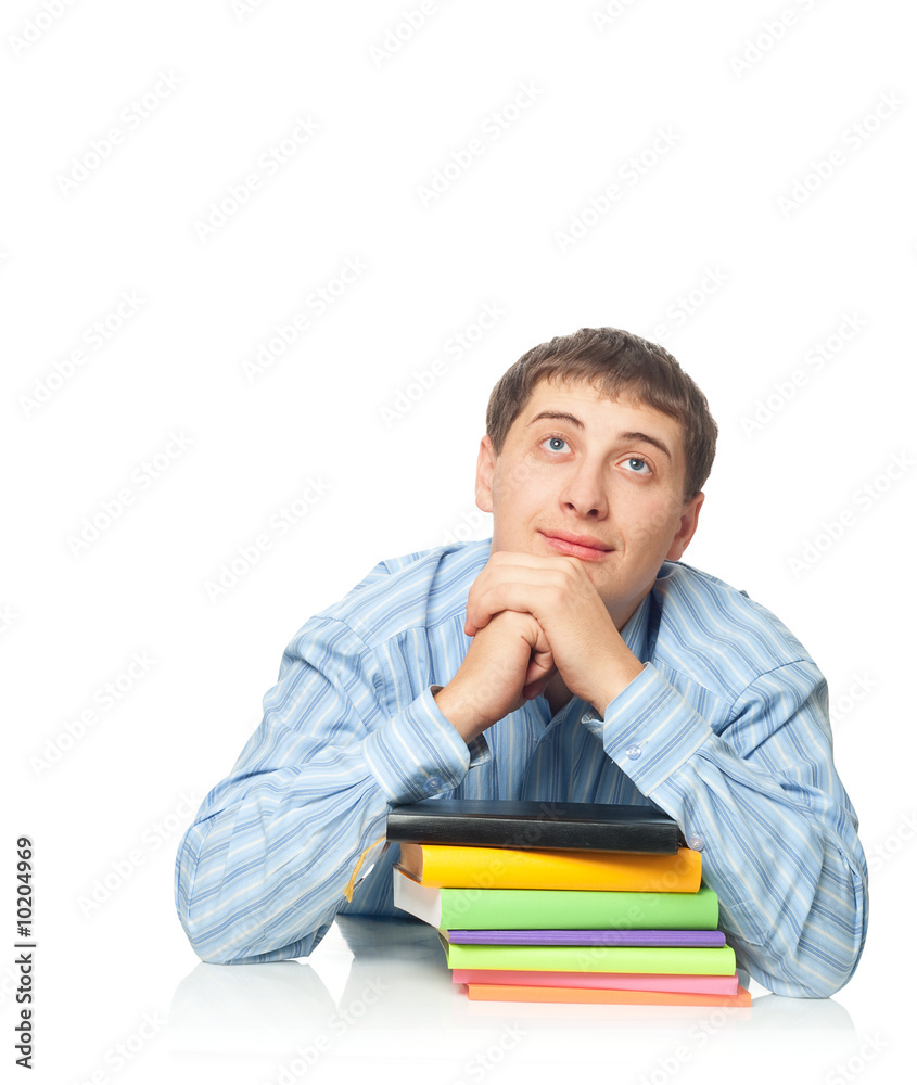 young adult man dreaming with books young adult man dreaming with books