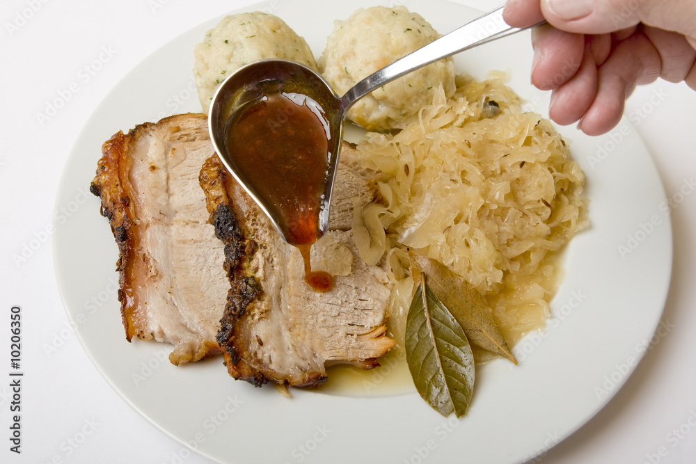 Schweinsbraten mit Semmelknödel und Sauerkraut Stock-Foto | Adobe Stock Schweinsbraten mit Semmelknödel und Sauerkraut Stock-Foto | Adobe Stock