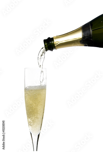 filling a glass cup with champagne wine isolated