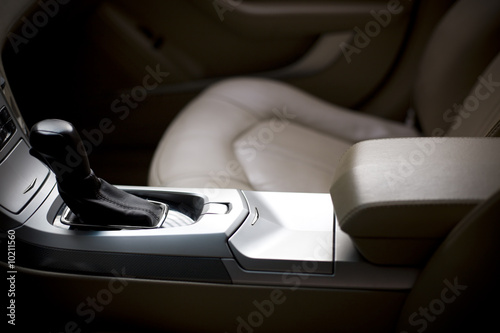 Gear stick and interior of a brand new modern car - shallow DoF photo