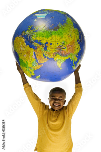 African American boy holding an inflatable globe photo