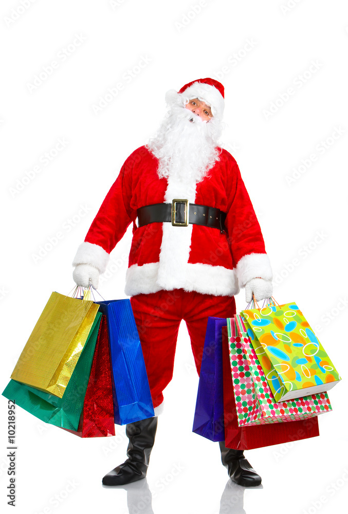 Shopping Christmas Santa. Isolated over white background. Shopping Christmas Santa. Isolated over white background.