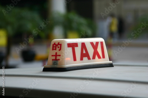 A closeup of a Hong Kong Taxi Sign