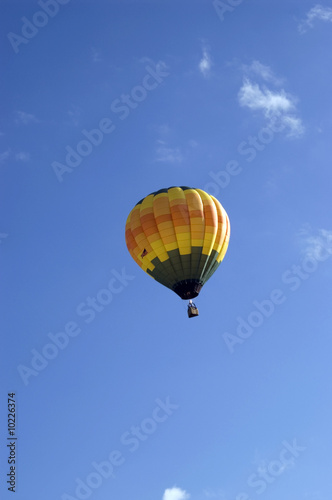 A single floating hot air balloon.