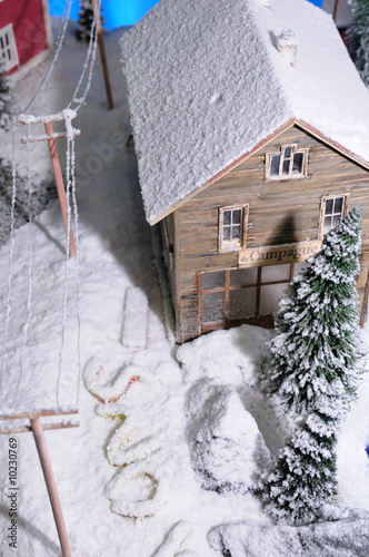 model of rural house covered by artificial snow © Igor Ostapchuk