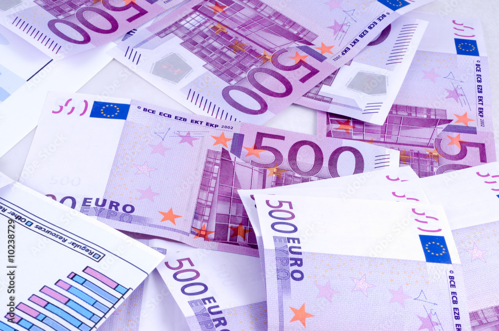 Business accessories on a background of diagrams.