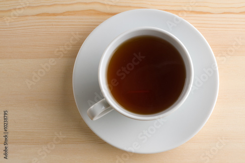 white cup with hot beverage