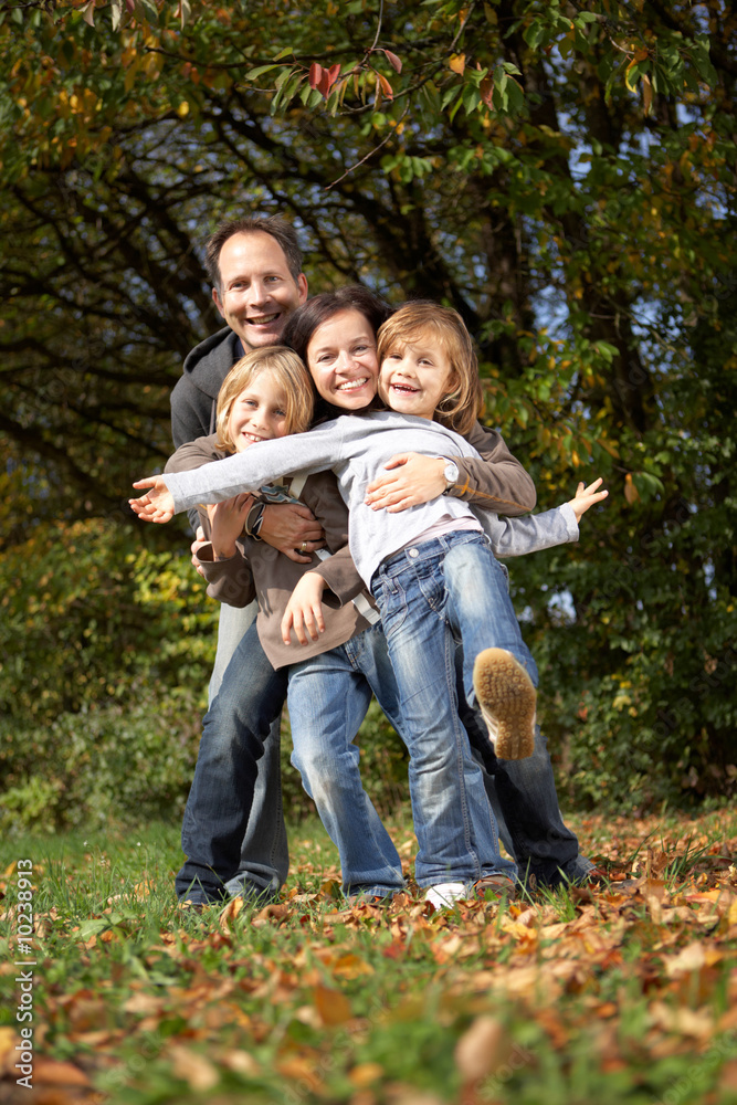 happy family of four enjoying their day off in nature