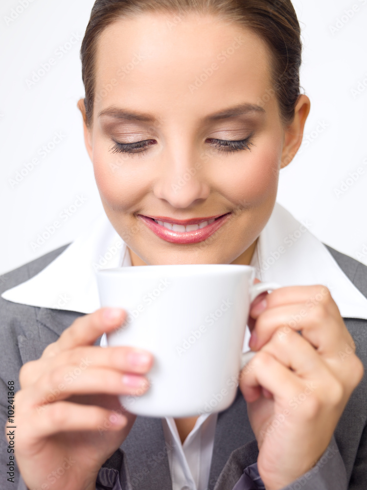 Portrait of beautiful and young business woman with coffee cup Portrait of beautiful and young business woman with coffee cup