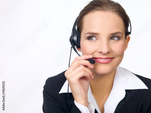 Portrait of beautiful and young business woman with headphones
