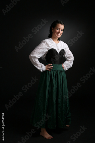 pretty teenage girl in long sleeved formal green gown