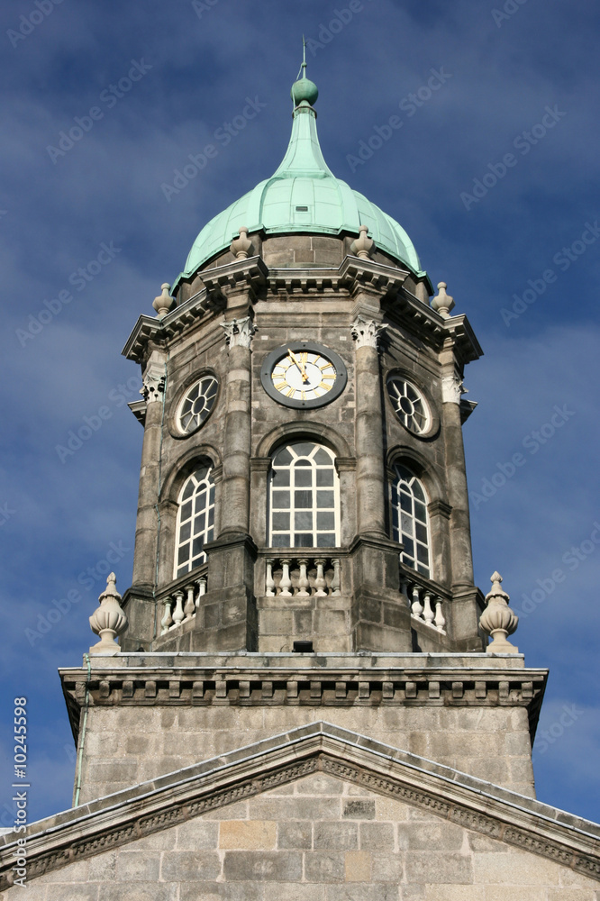 Dublin Castle clock tower and blue sky. Famous bulding.