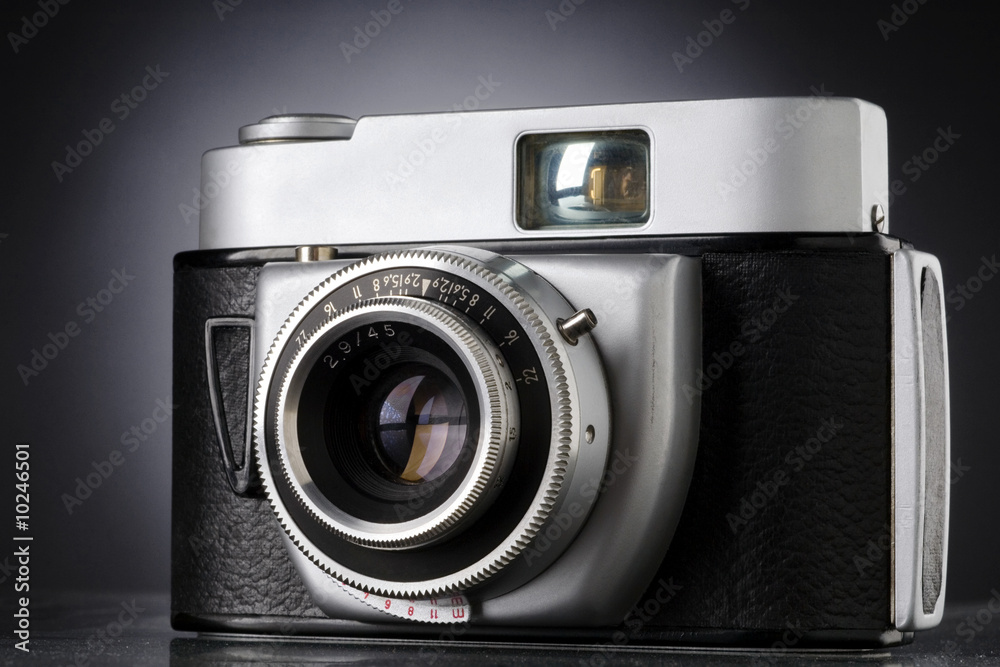 a vintage 35mm camera against dark background