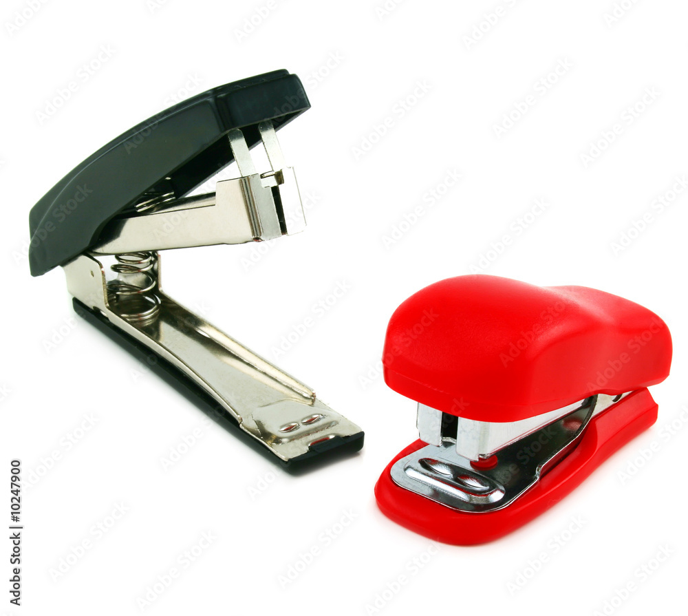 Two staplers isolated on a white background Two staplers isolated on a white background
