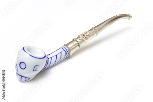 Photography skull opium pipe isolated on a white studio background