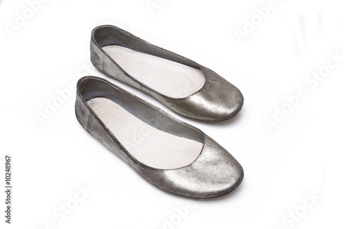ladies flat shoes isolated on a white studio background