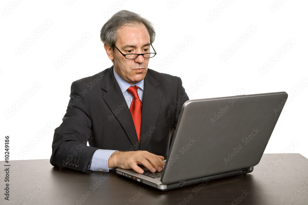 mature business man working with his laptop mature business man working with his laptop