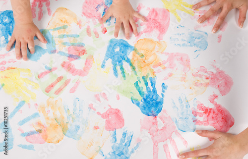 child hands colorful painting
