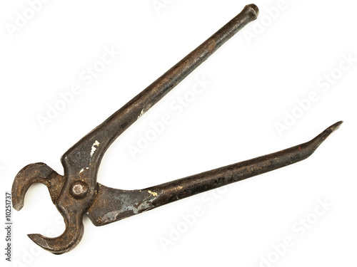 photo of a pair of rusty nippers against the white background
