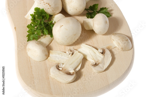 Portabello mushroom slices on wooden chopping board