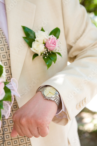 man looks at his watch photo