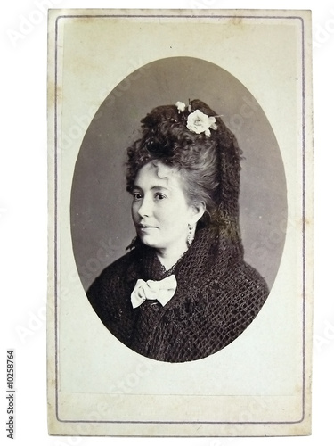 Vintage portrait of woman early 20 century on background.