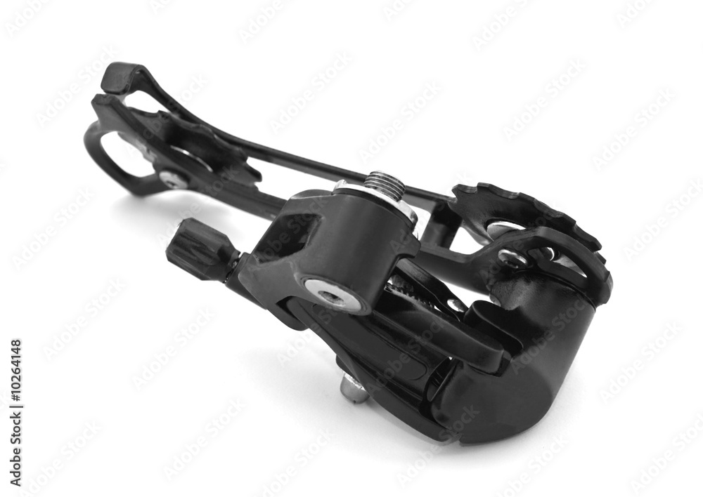 Bicycle rear derailleur against a white background. Bicycle rear derailleur against a white background.