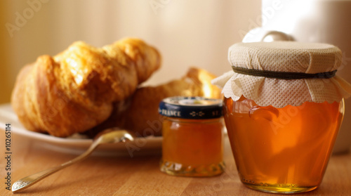 Breakfast with croissant and honey photo