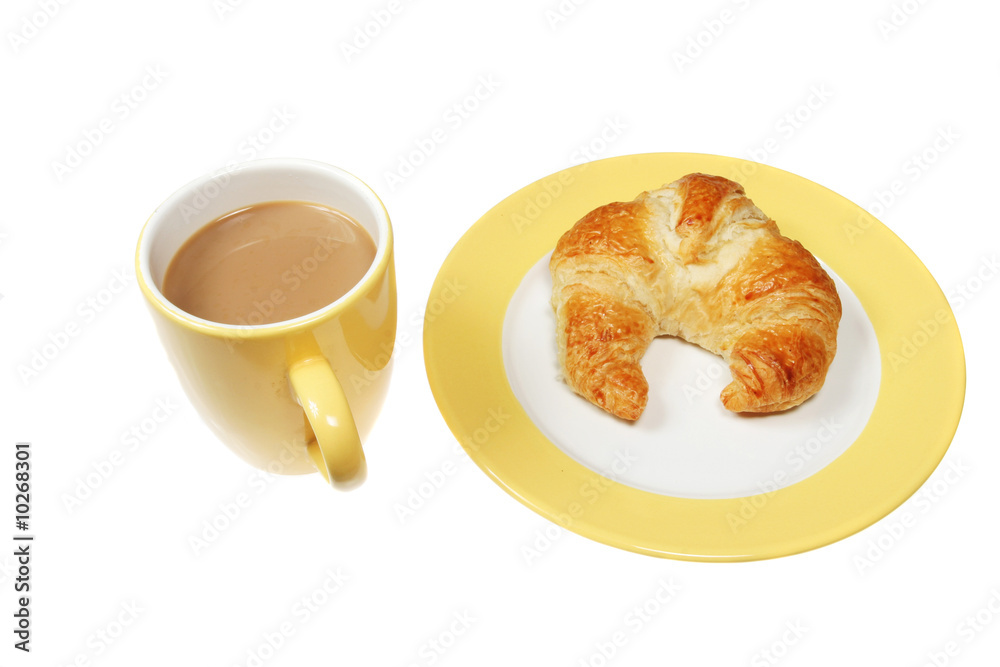Coffee and croissant on a plate isolated on white Coffee and croissant on a plate isolated on white