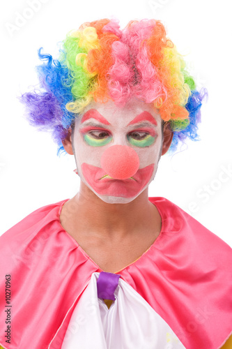 funny and colorful clown making a face on white