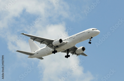 Unmarked passenger jet airplane in flight