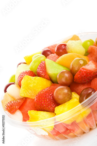 Delicious, colorful tropical fruit salad against a white