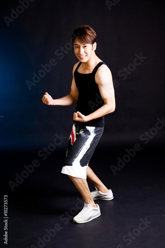 active sporty young guy in sports wear feeling energetic