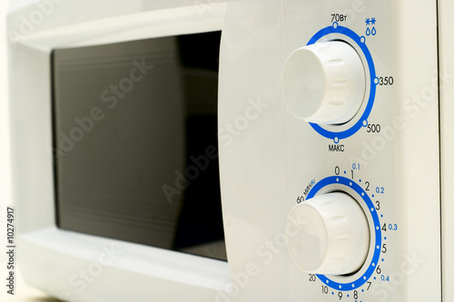 Microwave oven: adjusting knobs and the door close-up.