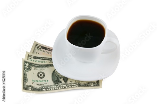 Cup of coffee and money isolated on white