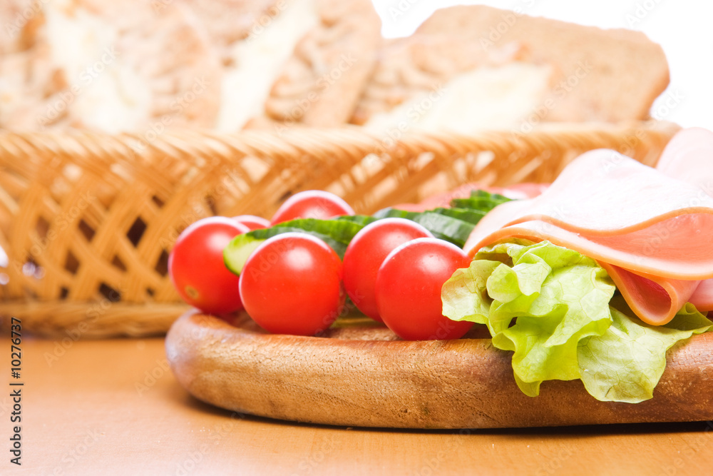 Fresh ham & salad on a wooden plate Fresh ham & salad on a wooden plate