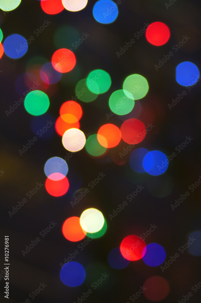 blurred motley garland lights group on dark background