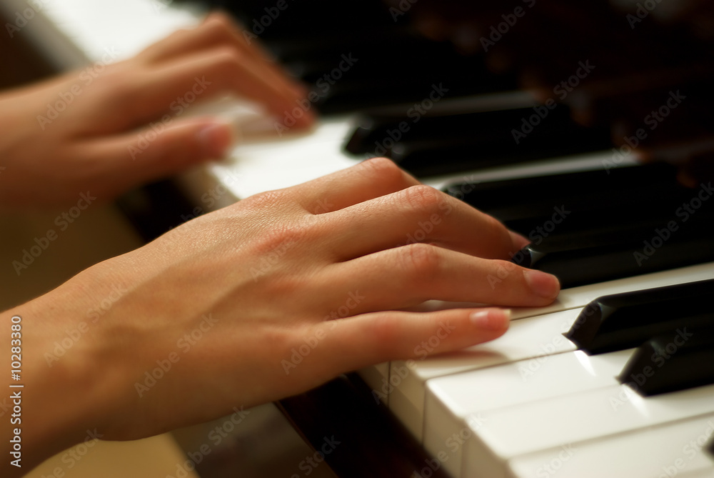 Young Girl's Hands Playing Piano Young Girl's Hands Playing Piano