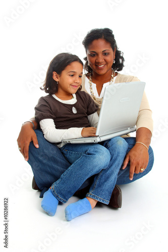 Minority woman and her daughter on white background