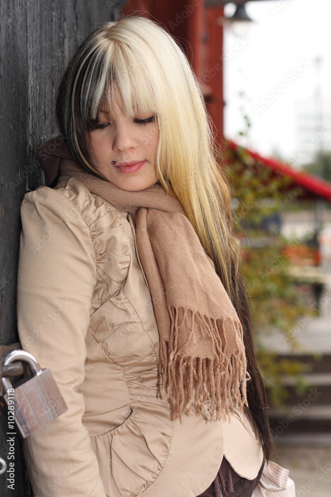 Beautiful young woman, fashion model, black and blond hair Beautiful young woman, fashion model, black and blond hair