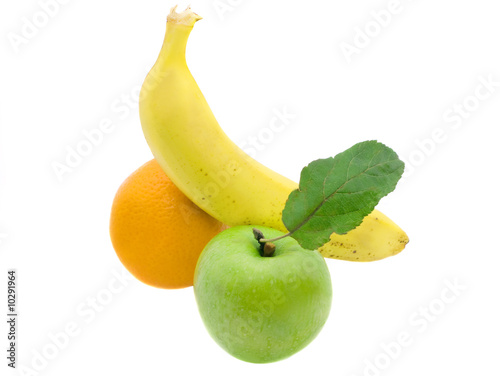 Green apple with a leaf, a banana and orange