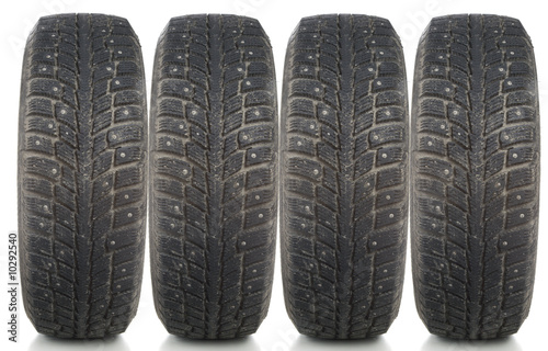 Winter tire on white background