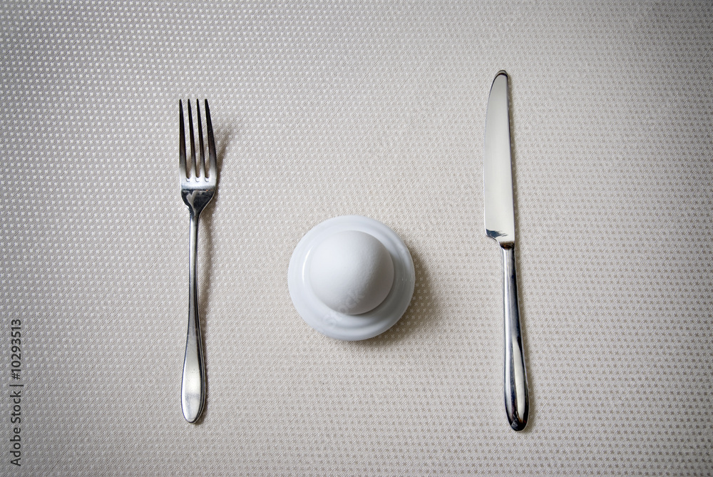 One egg with knife and fork One egg with knife and fork