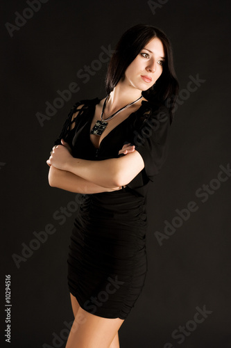 Beautiful young woman in black dress
