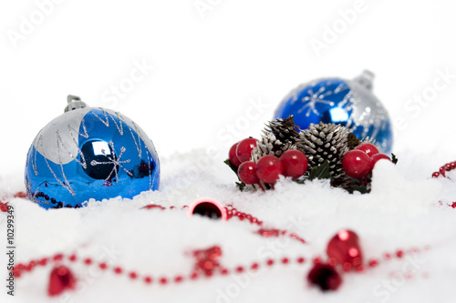 Horizontal image of blue christmas balls on snow