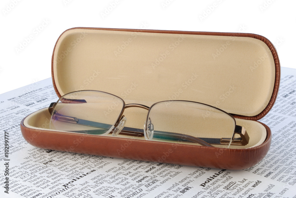 we take all news, glasses above a newspaper closeup we take all news, glasses above a newspaper closeup