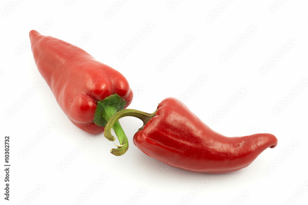 two red hot chili peppers on a white background
